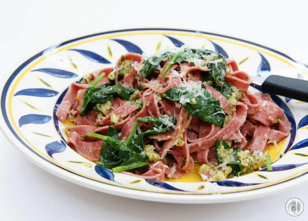 With spinach, rocket and chilli