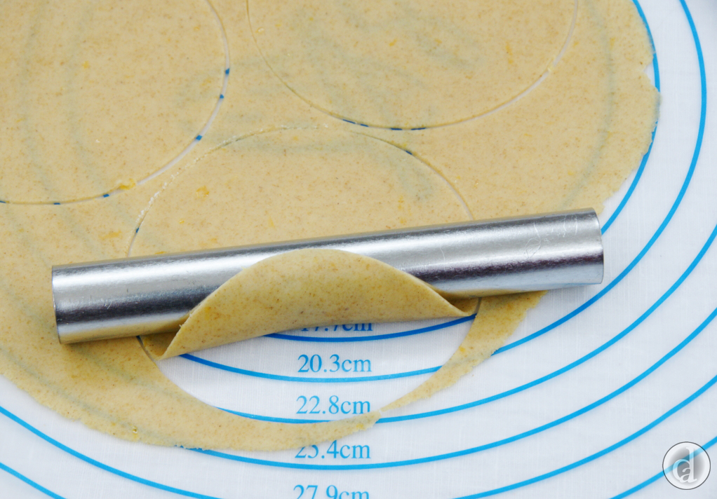 Wrapping the dough around a cannoli tube