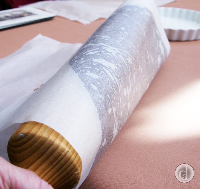 Using the rolling pin to move dough